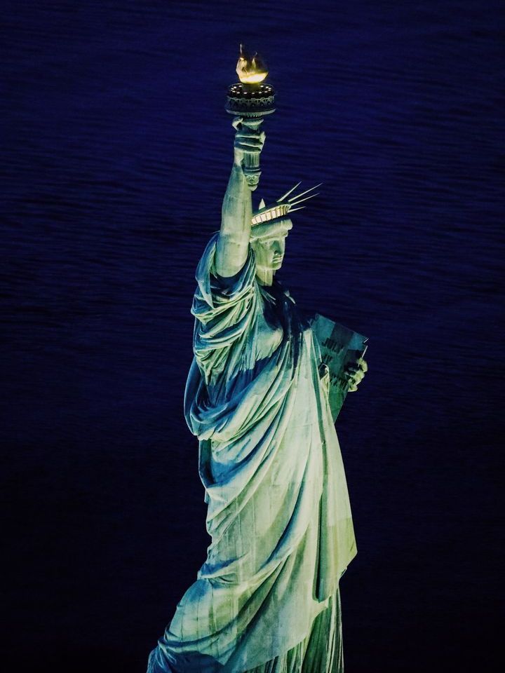 Stunning close up view of The Statue of Liberty during our NYC air tours. Night Time